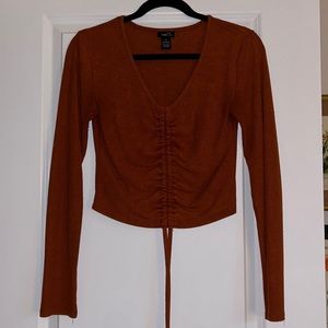 Orange long sleeve with adjustable drawstring